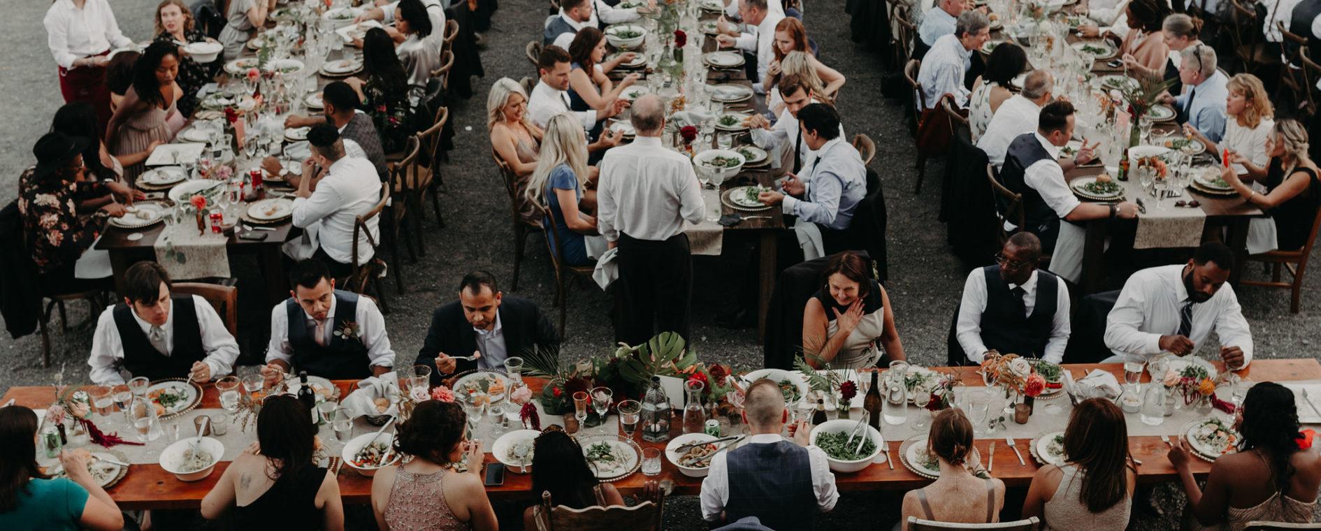 wedding guests at farm tables