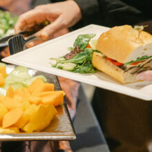 Serving on a buffet with a plate of food